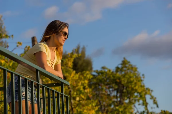 Beautiful casual woman enjoying the sunset, outdoor — Stock Photo, Image