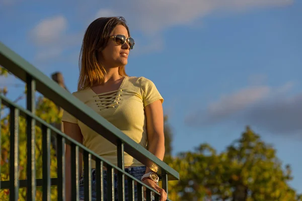 Beautiful casual woman enjoying the sunset, outdoor — Stock Photo, Image