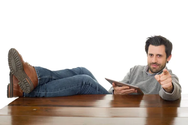 Happy man on a desk with a tablet pc, isolated — Stock Photo, Image