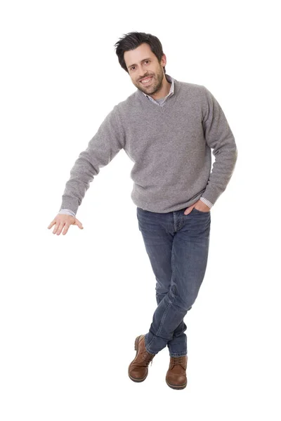 Homem casual com braço para fora em um gesto mostrando, isolado — Fotografia de Stock