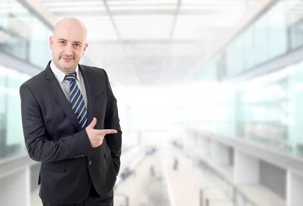 Happy business man pointing, at the office — Stock Photo, Image