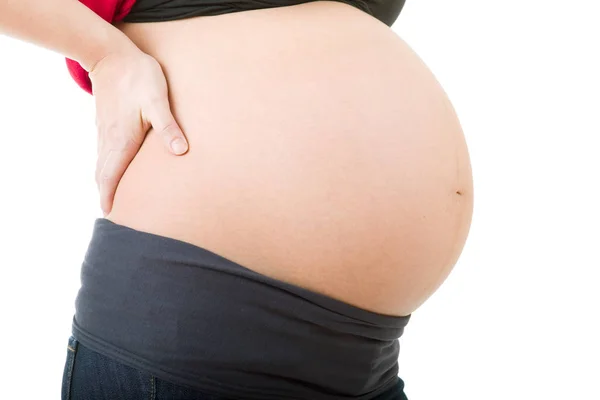 Primer plano de la mujer embarazada en el fondo blanco — Foto de Stock