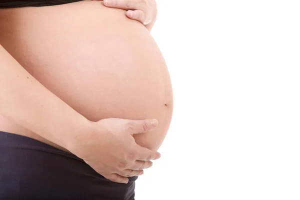 Närbild av gravid kvinna på vit bakgrund — Stockfoto
