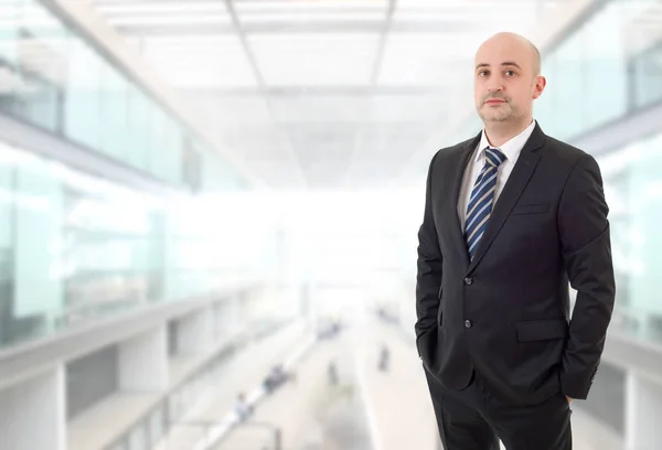 Young business man thinking, at the office — Stock Photo, Image