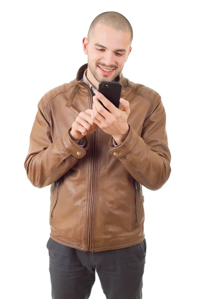 Jeune homme heureux occasionnel avec un téléphone, isolé — Photo