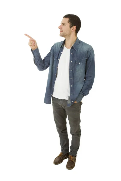 Young casual man pointing, isolated on white — Stock Photo, Image