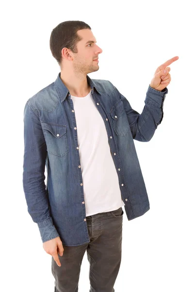 Young casual man pointing, isolated on white — Stock Photo, Image