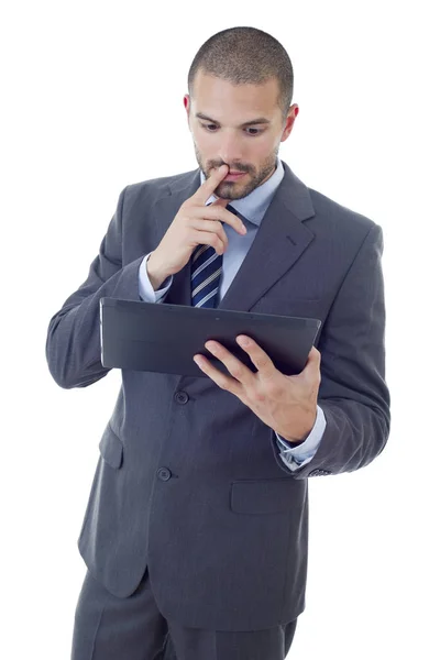 Jonge zakenman werkt met een tablet pc, geïsoleerd — Stockfoto