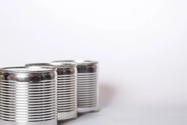 Three Metal Cans White Background Copy Space Royalty Free Stock Images