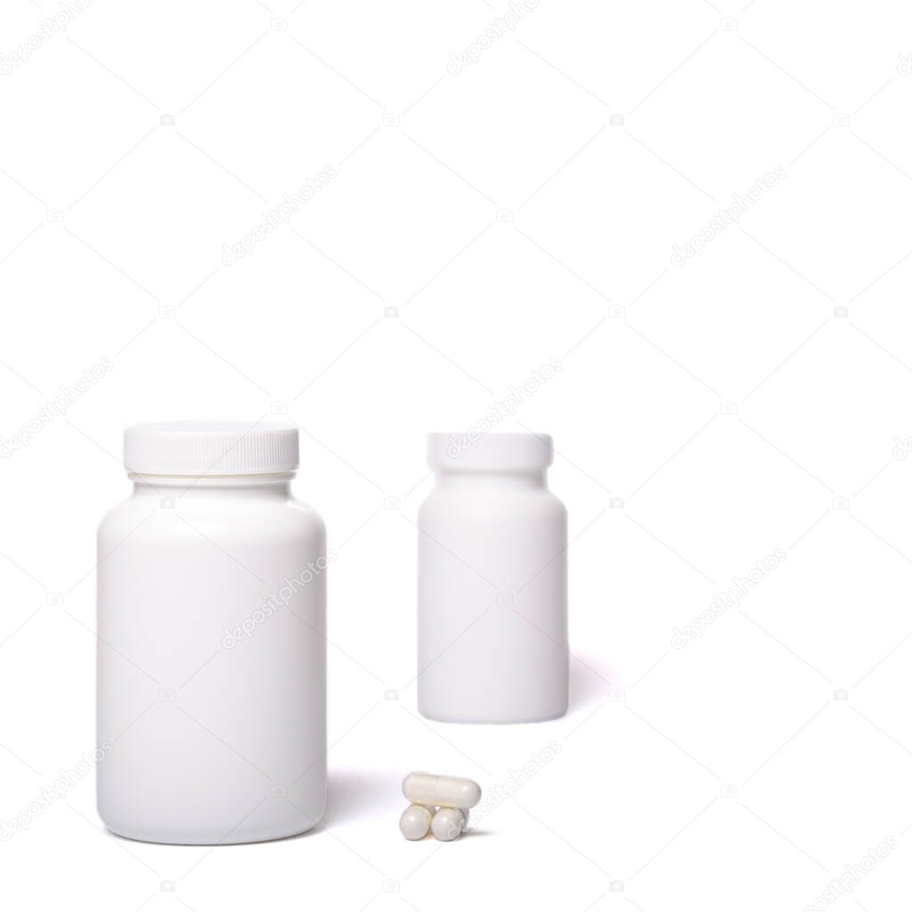 Two white containers with no logo and pilules on a white background.