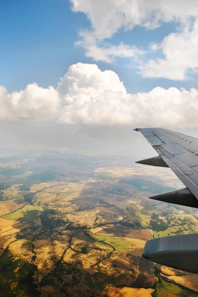 View from the plane to the ground with roads and fields — Stock Photo, Image