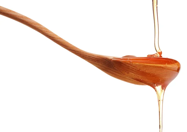 Miel goteando de un cazo de miel — Foto de Stock