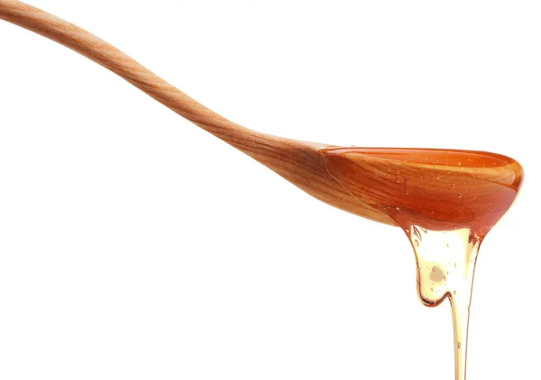 Μέλι που στάζει από μια ξύλινη χέστρα — Φωτογραφία Αρχείου