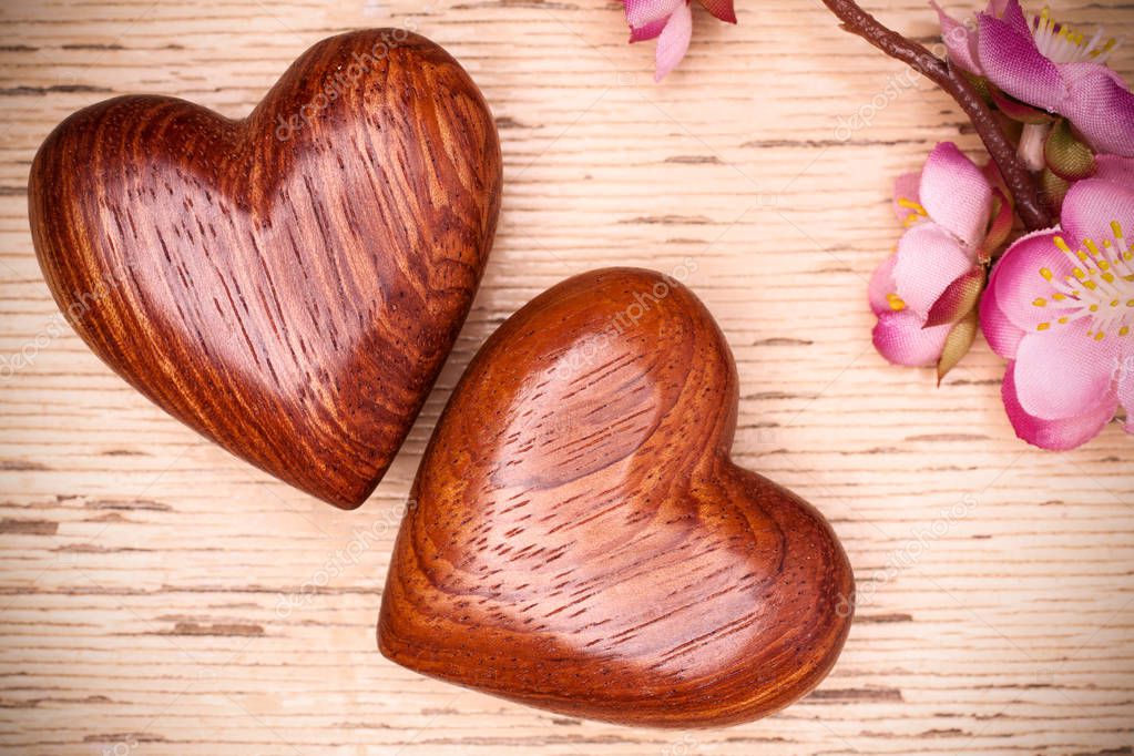 Two wooden hearts on rustic wood background. Valentines days concept.  Greeting card with copy space. Stock Photo by natika