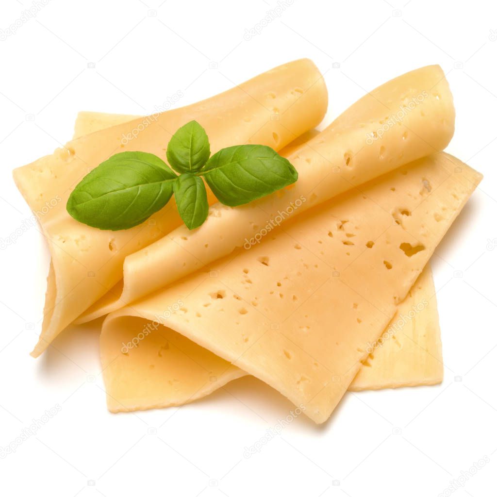 Cheese slices and basil herb leaves Stock Photo by ©natika 129814210