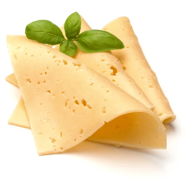 Ломтики сыра и листья базиликовой травы — стоковое фото