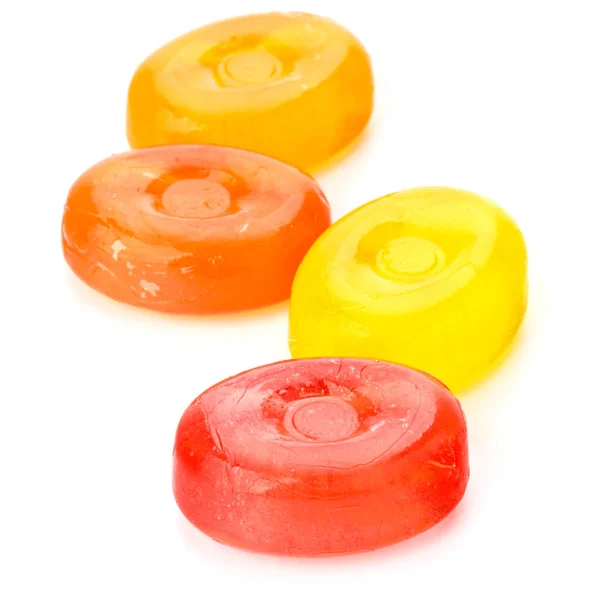 Four colorful fruit hard sugar candies — Stock Photo, Image