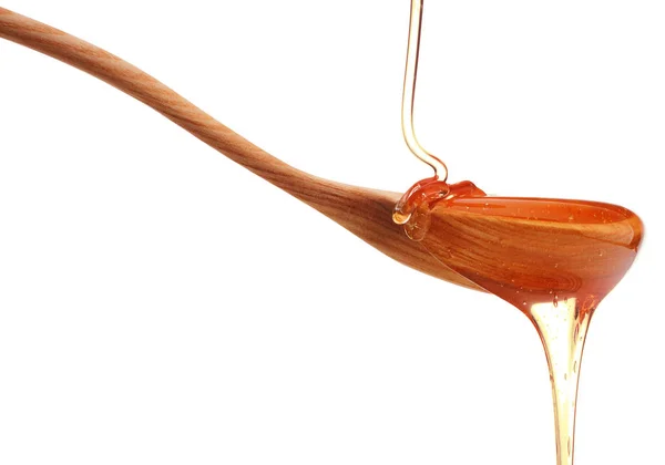 Honey dripping from  dipper — Stock Photo, Image