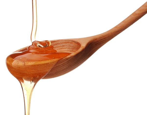 Honey dripping from  dipper — Stock Photo, Image