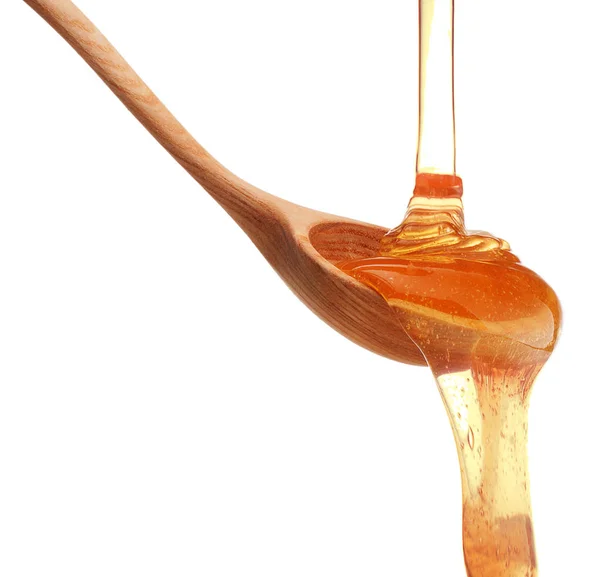 Honey dripping from  dipper — Stock Photo, Image