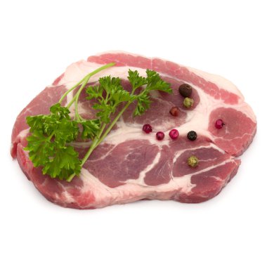 Çiğ domuz eti boyun pirzola et maydanoz bitki yaprakları ve biber ile 