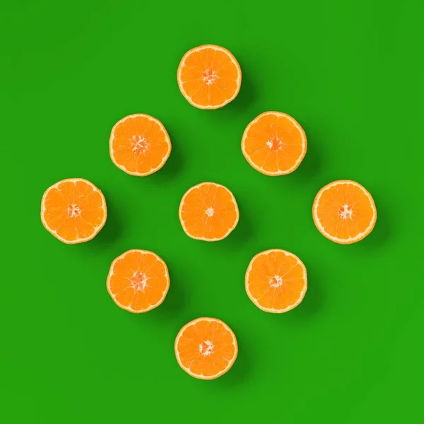 Fruit pattern of fresh orange tangerine or mandarin on green bac — Stock Photo, Image