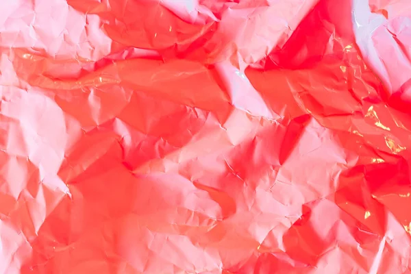Crushed paper background in vibrant bold gradient holographic ne — Stock Photo, Image