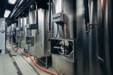 Craft beer production line in private microbrewery. Maturation tanks