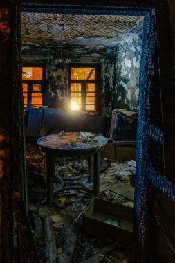 Burnt house interior. Burned furniture, charred walls and ceiling in black soot