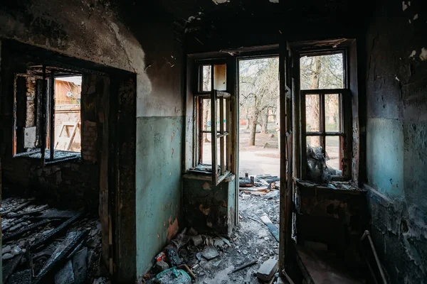 Burnt and collapsed old house interior. Consequences of fire.