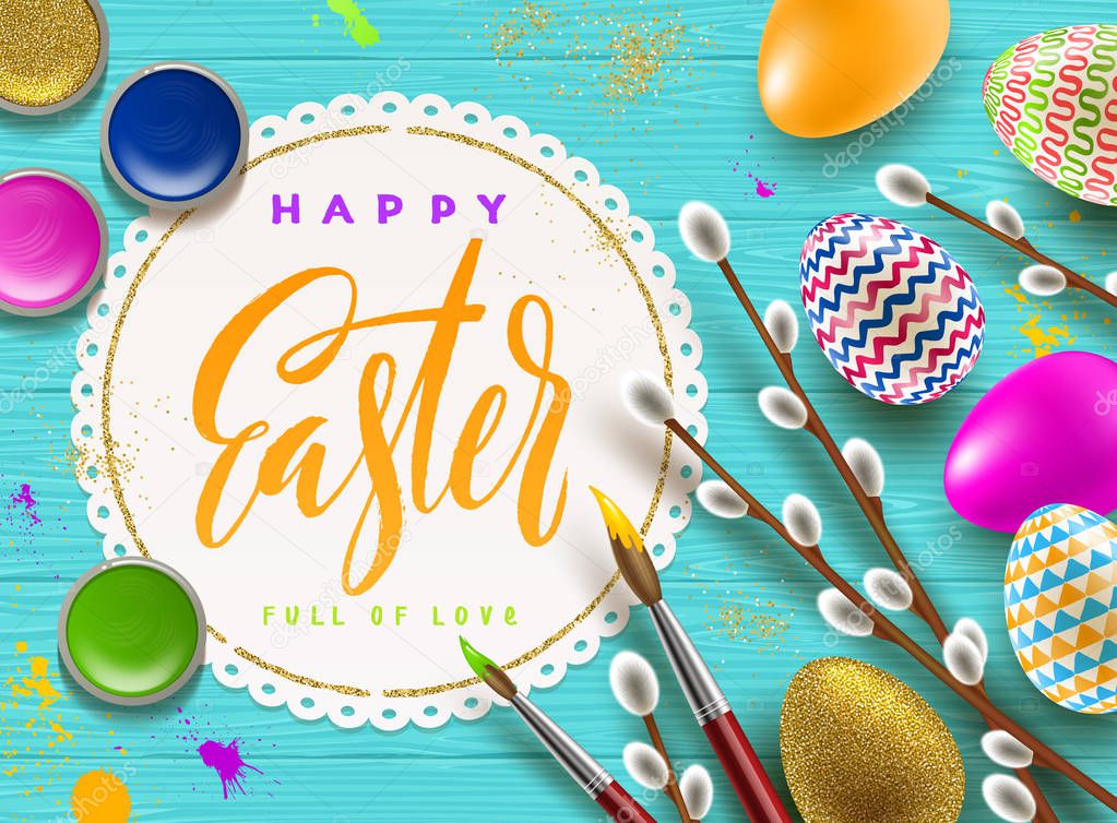 Easter greeting illustration. Pussy-willow branches, paint decorated multicolored eggs and paper frame with brush calligraphy greeting on a wooden desktop.