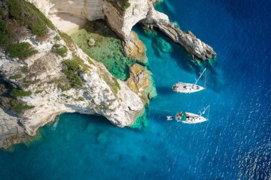 Sailboats in a beautiful bay, Paxos island, Greece. clipart
