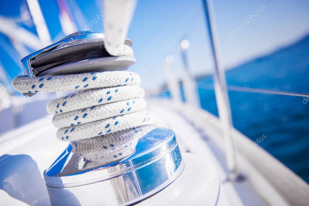 Sailboat winch and rope yacht detail. Yachting theme