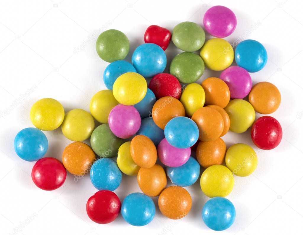 colored round candies on a white background