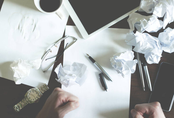 The Young male business entrepreneur has a problem with writing a business plan.