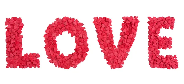 Love word shape from hearts candy sprinkles over white — Stock Photo, Image