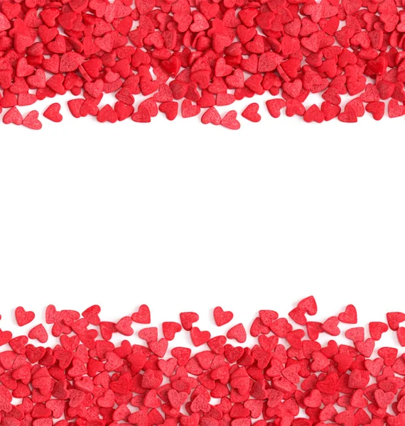 Horizontal fond sans couture, bonbons cœurs rouges saupoudrer sur Images De Stock Libres De Droits