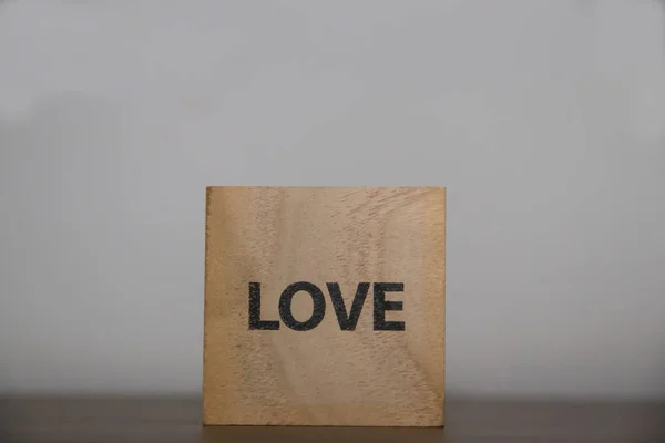 Enjoy good life, love, life. Positive inspirational messages on wooden cubes