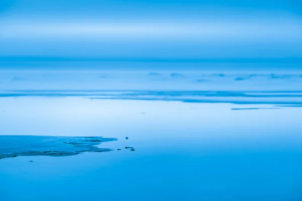 Beautiful winter sea coast landscape toned blue — Stock Photo, Image