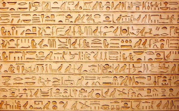 Egyptian hieroglyphs on wall Stock Image