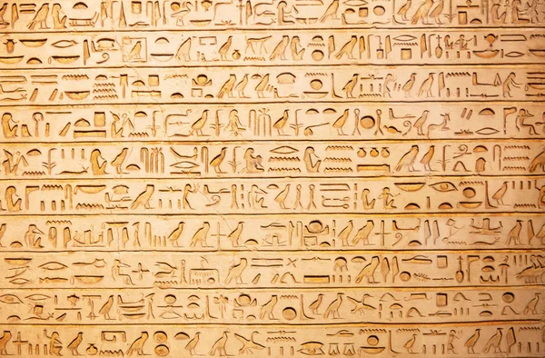 Egyptian hieroglyphs on wall Stock Photo