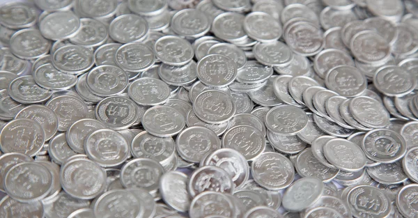 Huge pile of grey China coins