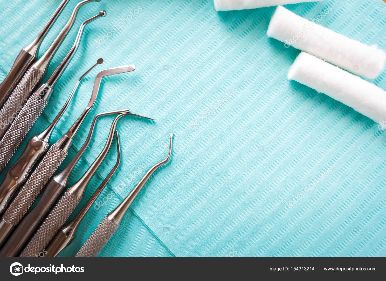 Dental cotton rolls, instruments on the napkin. Top view with copy space for text. Dentist