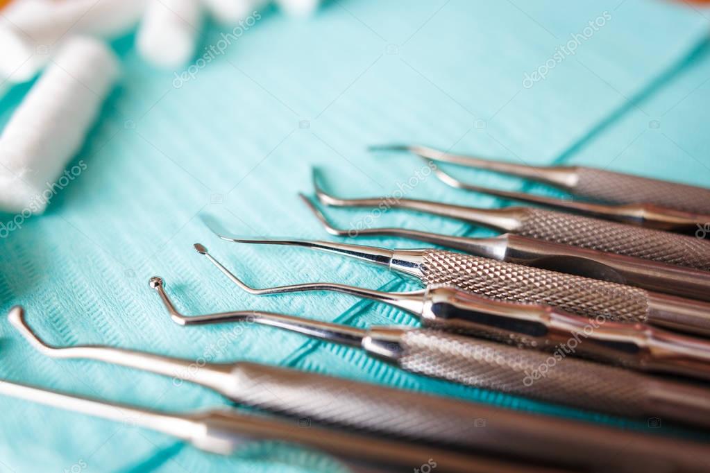 Dental cotton rolls, instruments on the napkin. Top view with copy space for text. Dentist