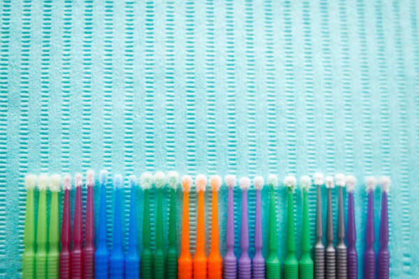 Disposable dental microbrush micro applicator - restorative dental product. Top view with copy space for text