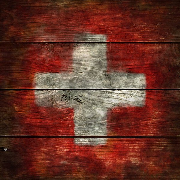 swiss flag on wood