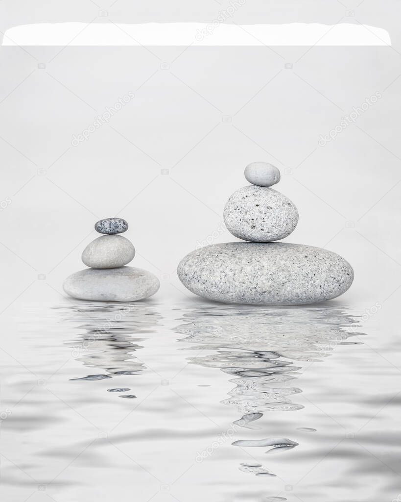 Smooth Pebble Stone Cairns On White