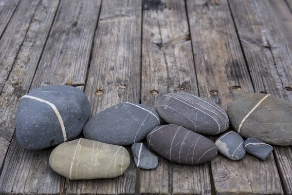 Pebble Collection On Old Pier — Stock Photo, Image