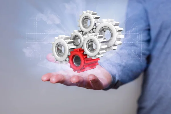 Man with gears and circuit diagram in the hand.