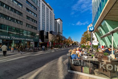 VIENNA, AUSTRIA - SEPTEMBER 27, 2018: People sitting in outdoor cafe on Landstraber Hauptstrabe  - main street in Landstrabe district, running along Wien Mitte train station.